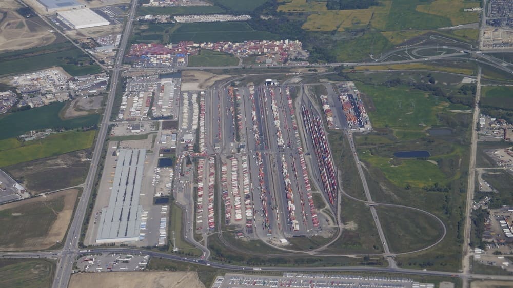 CP Vaughan Intermodal Terminal in Concord, Ontario — stacked shipping containers and intermodal railcars at the CP rail ramp serving Toronto and Greater Toronto Area drayage